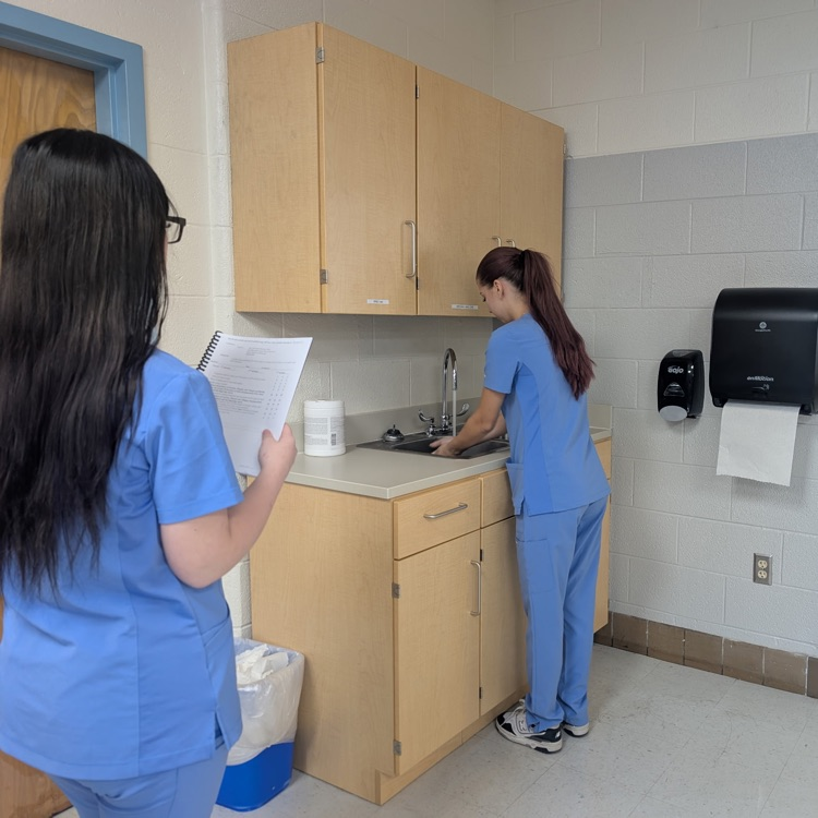 patient care tech students practicing skills