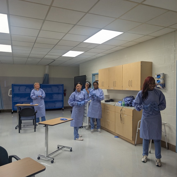 patient care tech students practicing skills