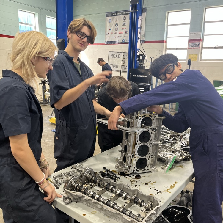 auto tech 1 students working on an engine