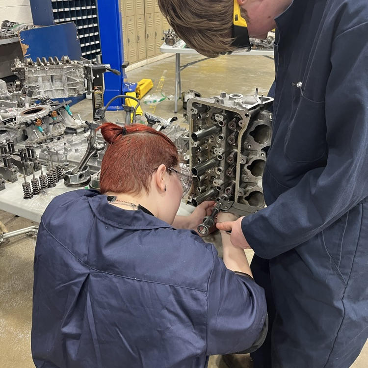 auto tech 1 students working on an engine