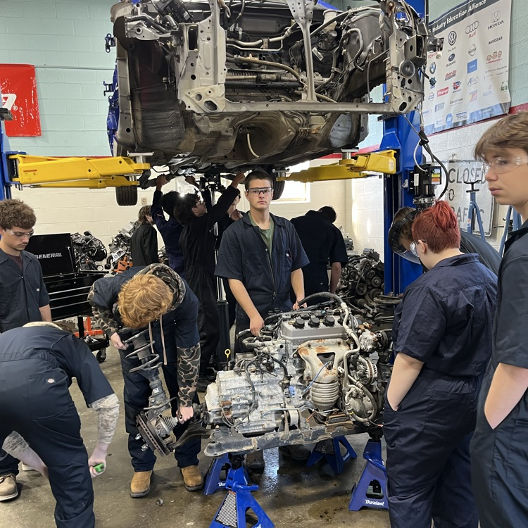 auto tech 1 students working on an engine