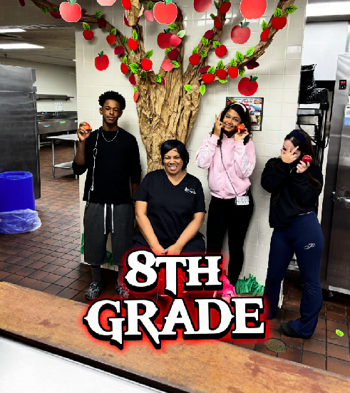 A JMS cafeteria staff member and 3 8th grade students participating in the Crunch heard around the Commonwealth event by biting into apples