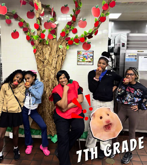 A JMS cafeteria staff member and 4 7th grade students participating in the Crunch heard around the Commonwealth event by biting into apples