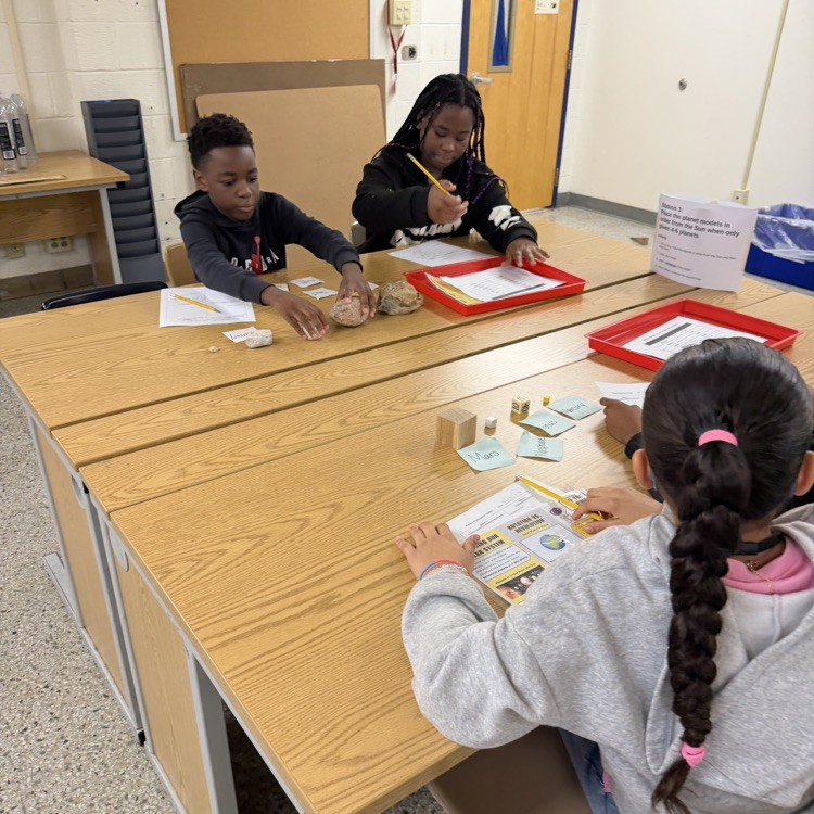 student working to order the planets.