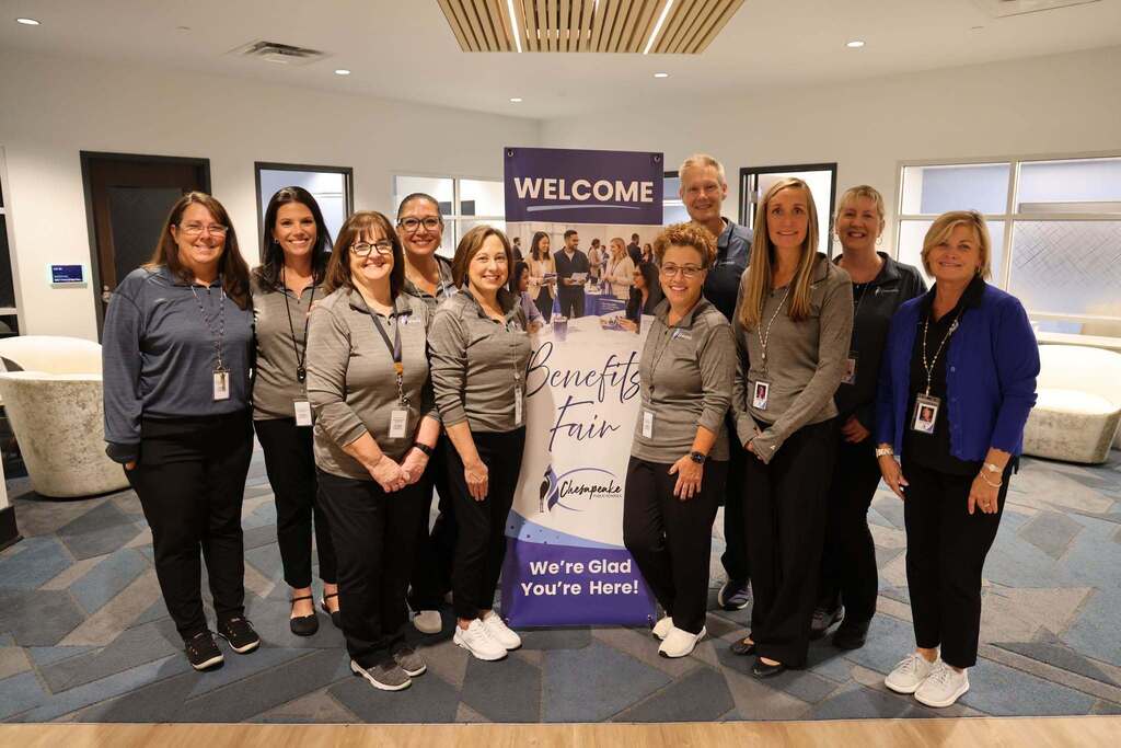 The Department of Benefits together at the Benefits Fair.