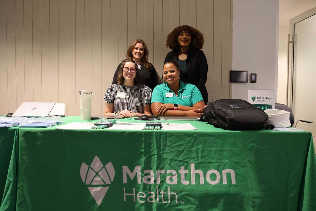 Marathon Health providers together at the benefits fair.