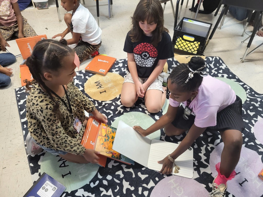 Kids making simple machines with books