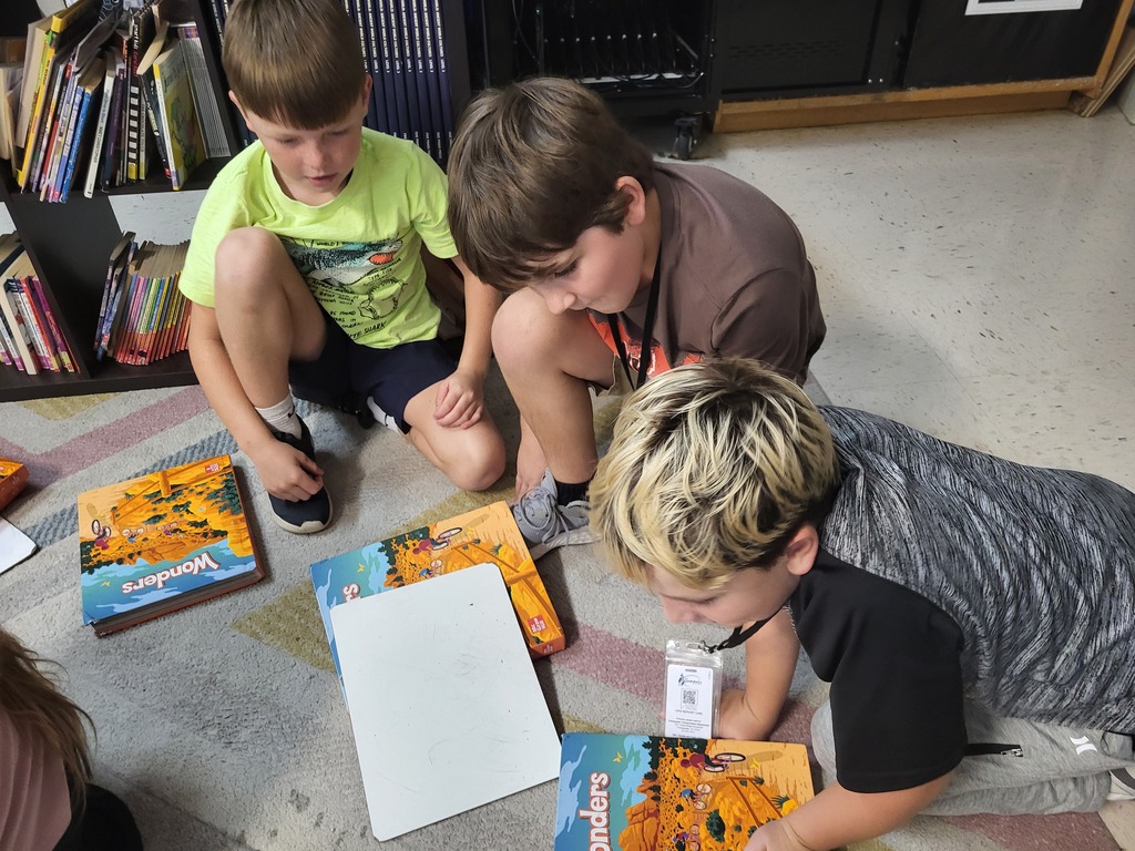 Kids making simple machines with books