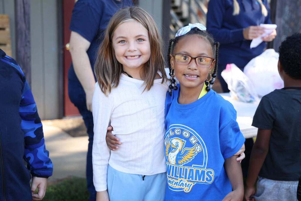 two friends smile for the camera
