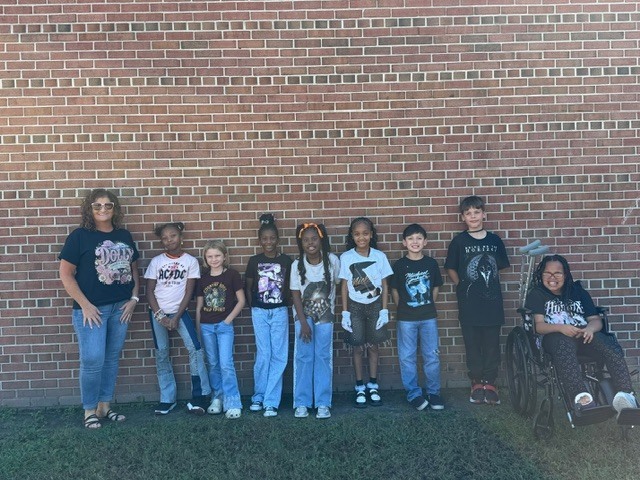 Kids in band shirts