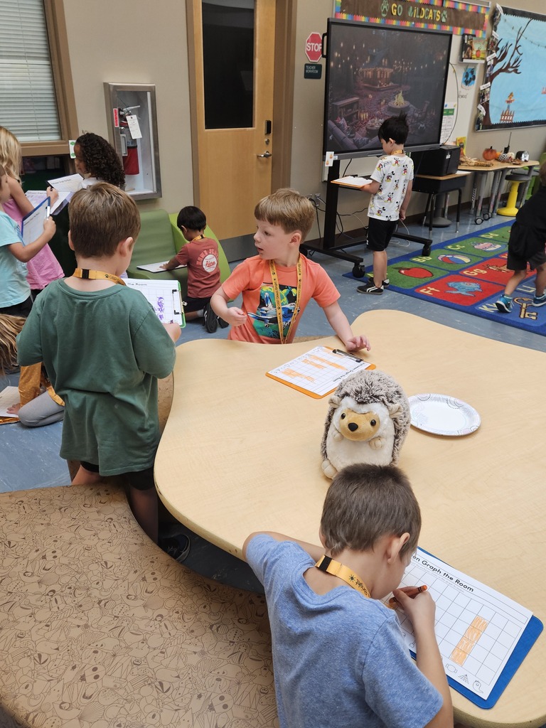 Hedgie the Hedgehog stuffed animal overseeing kindergarten students working in the Hub.
