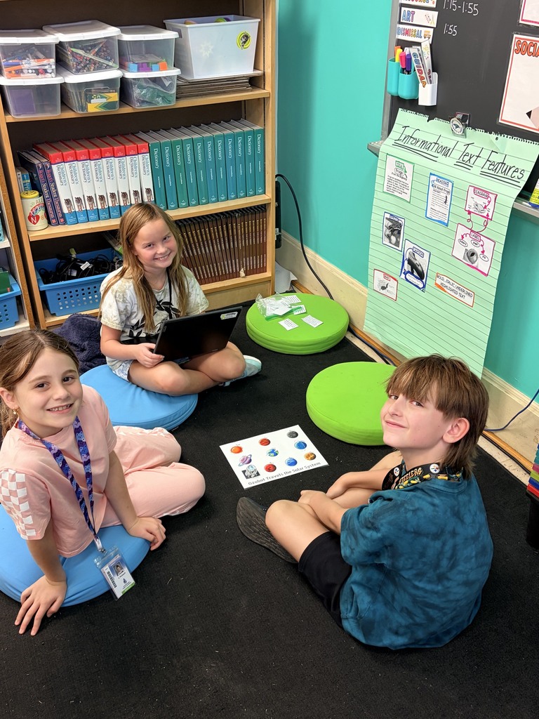 students using ozobots to review planets 