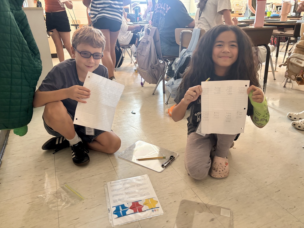 alt text for photos Students in Ms. McCoy’s class use Versa-Tiles puzzles to solve story problems and practice estimation and computation.