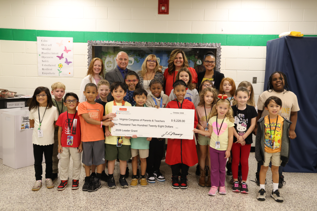 Students and teachers smile with Check