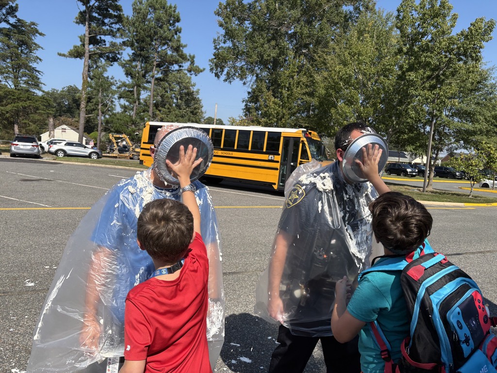 Students pie teachers in the face with whip cream 