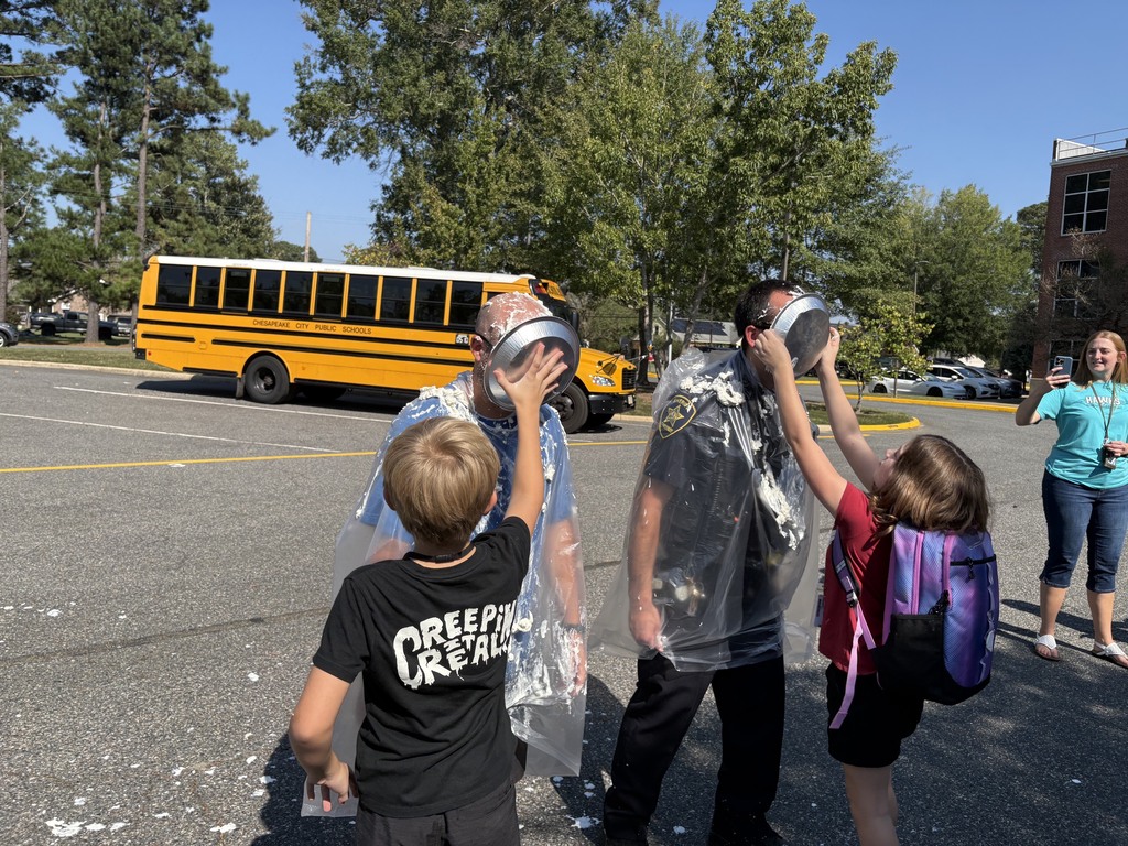 Students pie teachers in the face with whip cream 