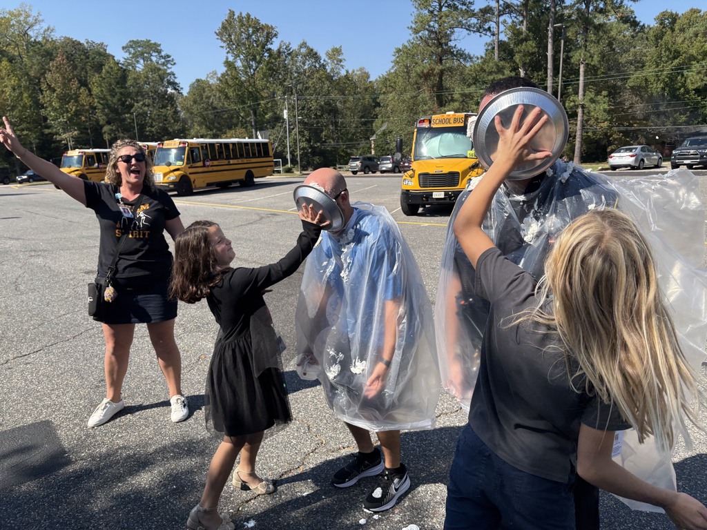 Students pie teachers in the face with whip cream 