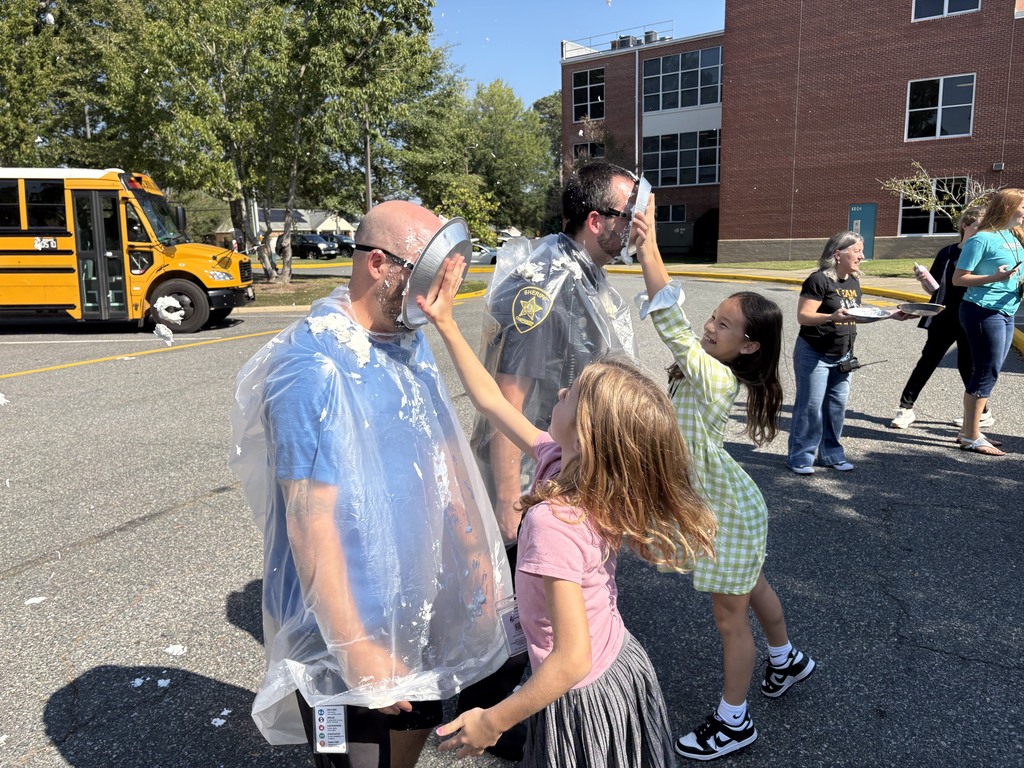 Students pie teachers in the face with whip cream 