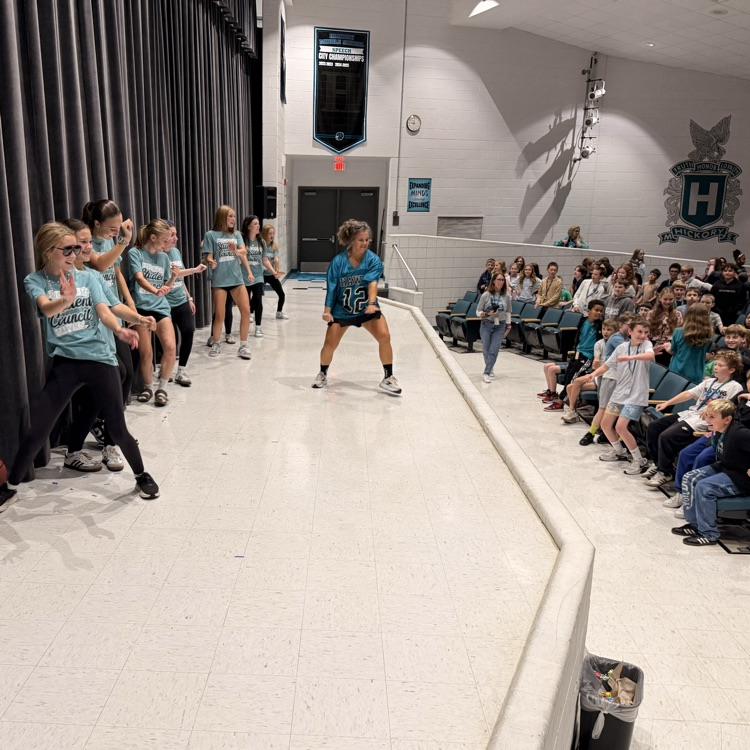 students swerving and curving at the pep rally
