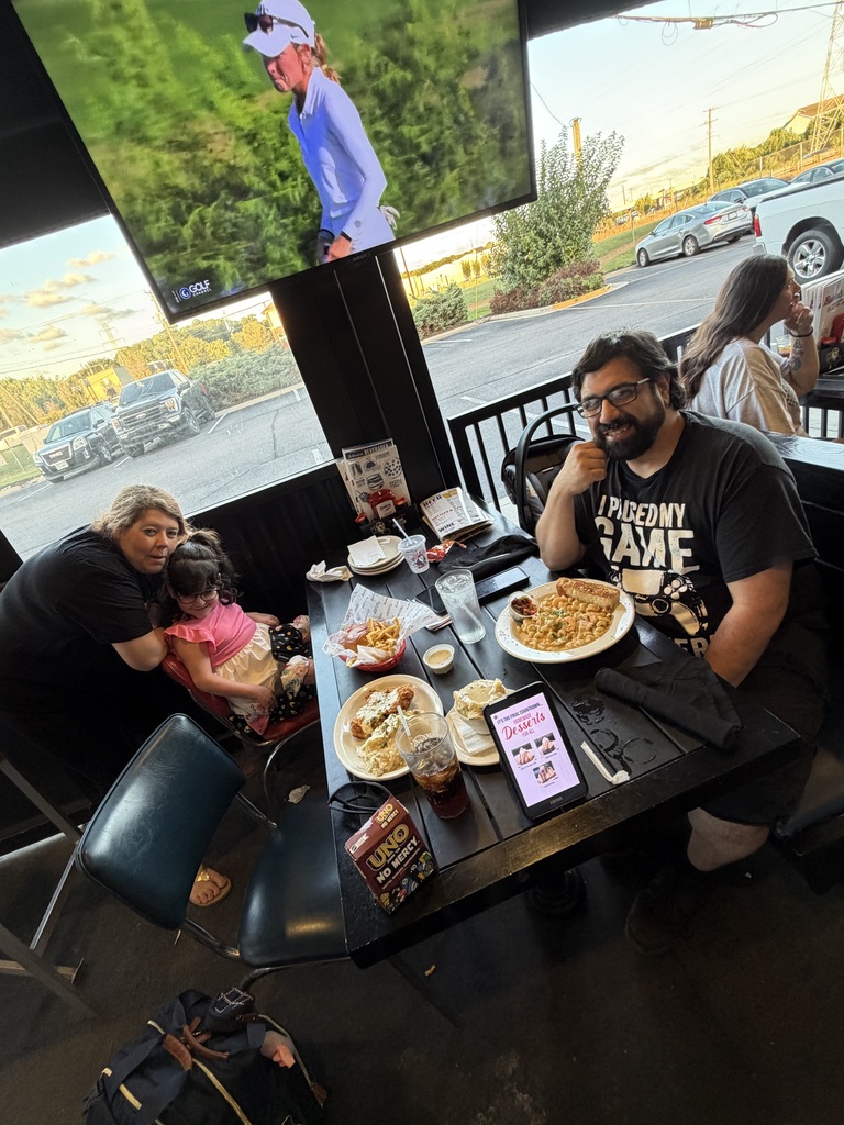 GTP family poses while enjoying dinner at Bubba's 33 for Dine to Donate night