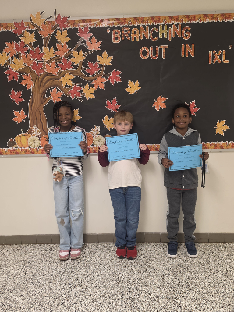 Third grade IXL Leaderboard winners pose together with their certicates