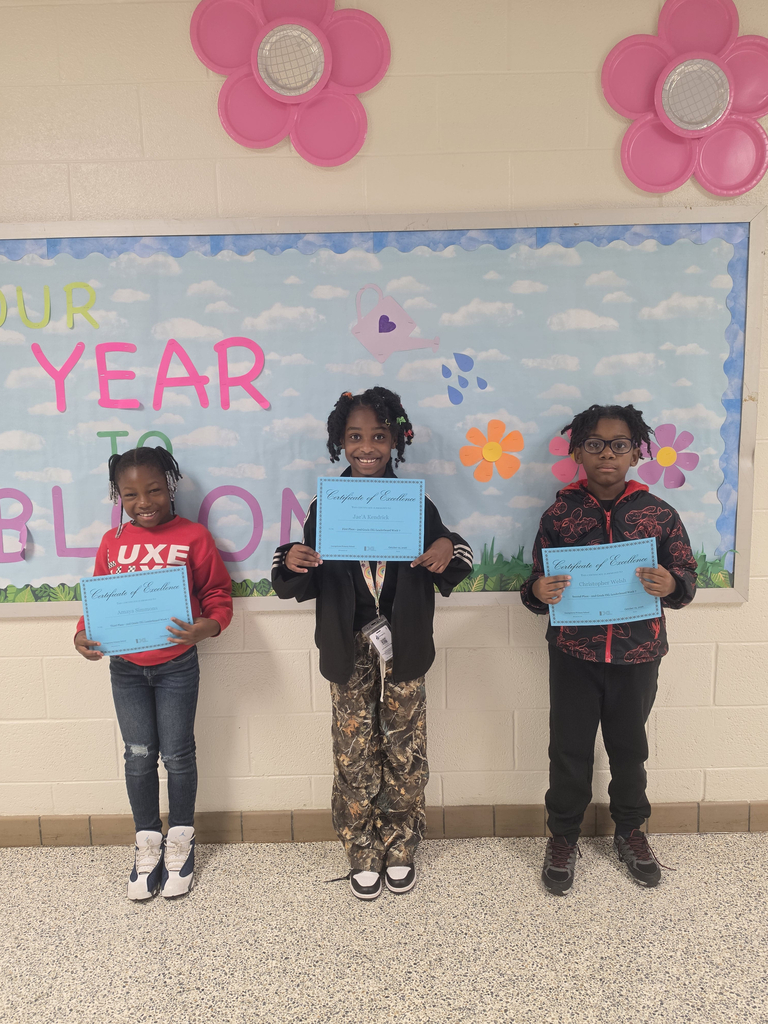 second grade IXL leaderboard winners pose with their certificates