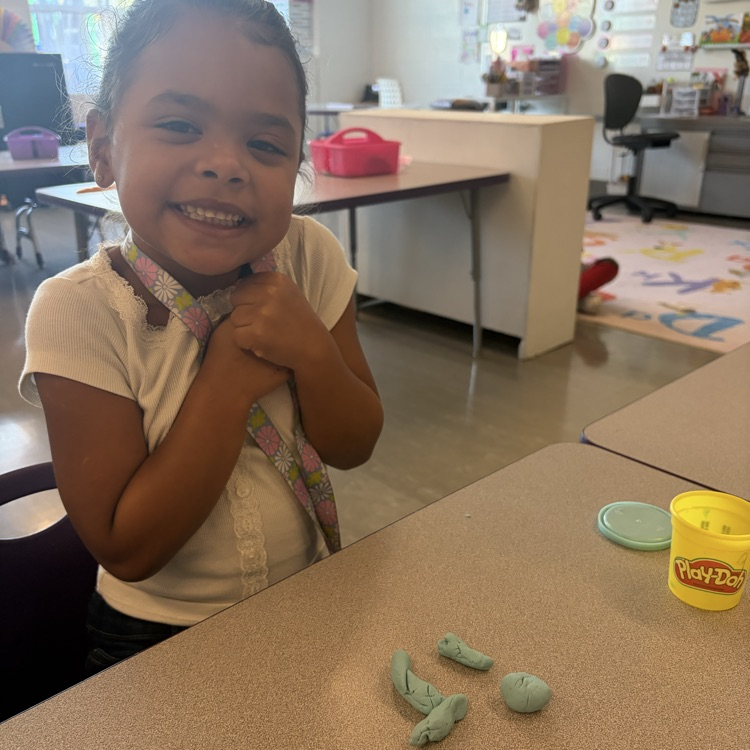 student using play dough to make sight words