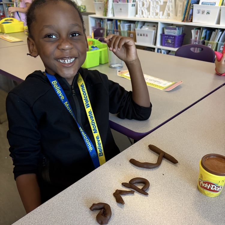 student using play dough to make sight words