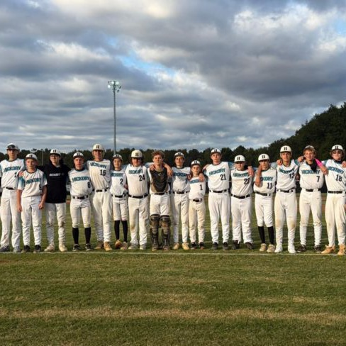 8th grade baseball with arms around each other to celebrate