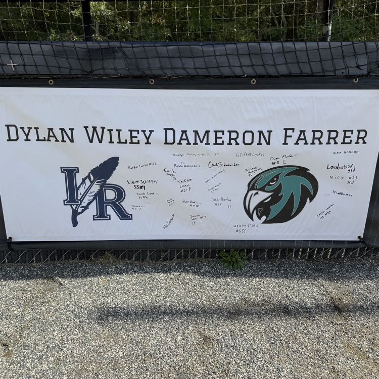 sign hung on a fence in memory of Dylan Farrer