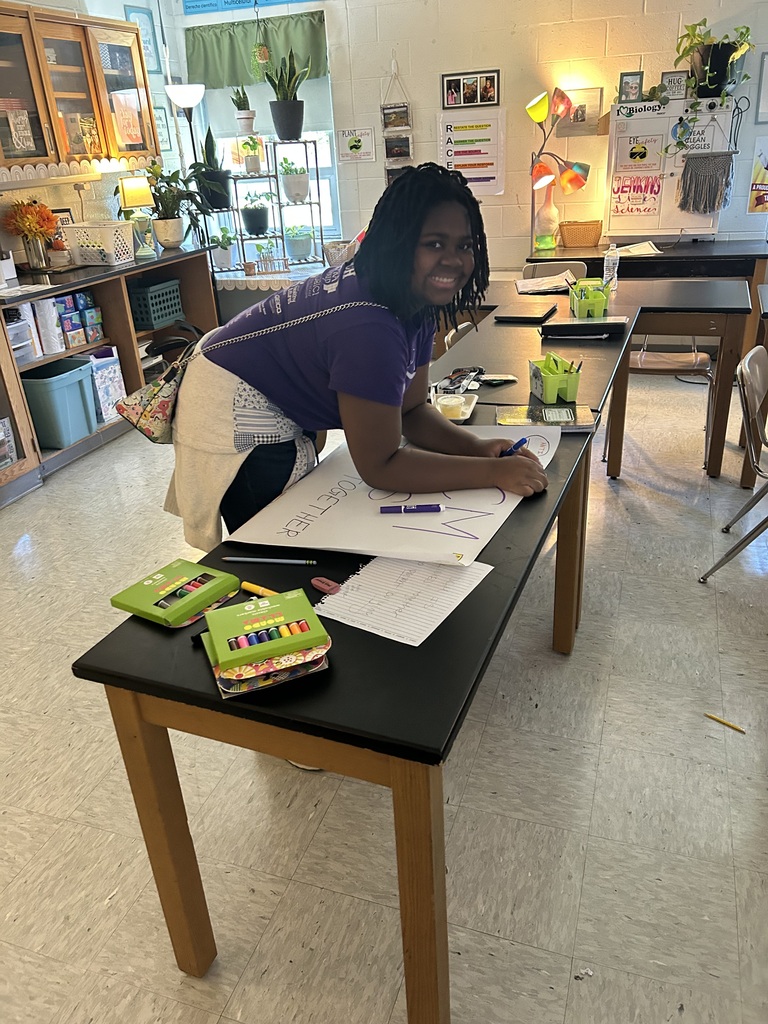 a student making a post for unity day