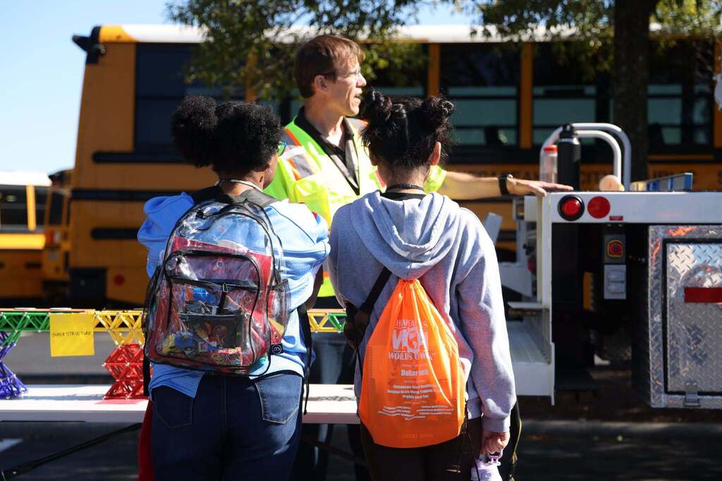 students discuss city career with employee
