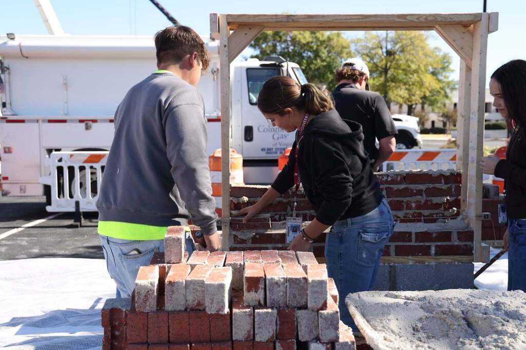 student learns bricklaying