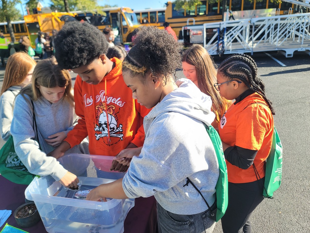 8th grade students participating in hands-on stations at the World of Work Field Trip 