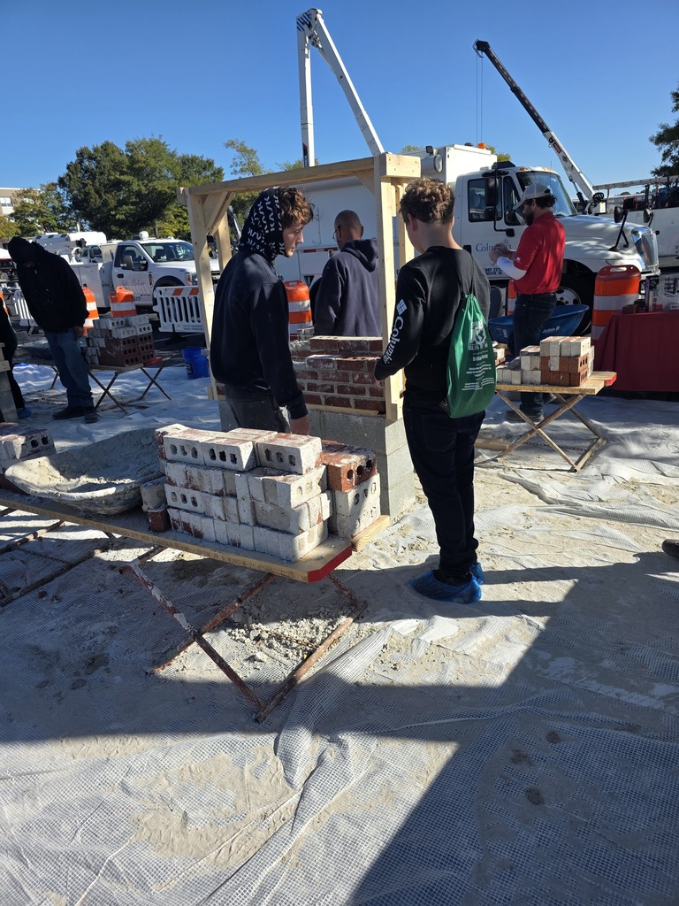 8th grade students participating in hands-on stations at the World of Work Field Trip 