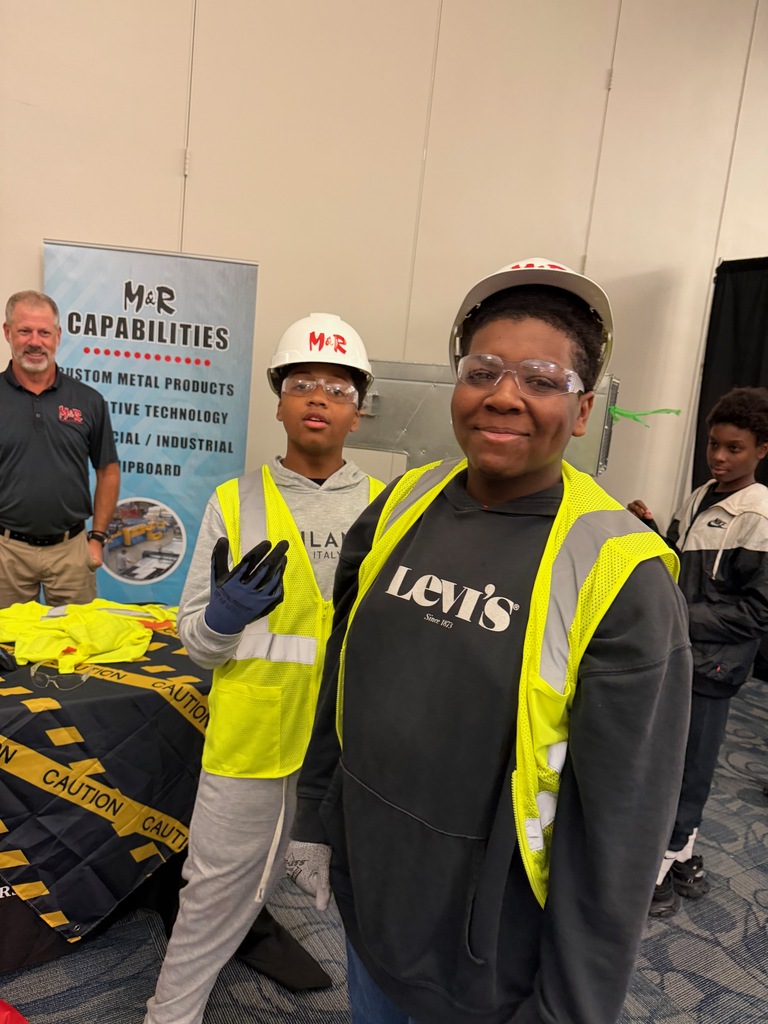 8th grade students participating in hands-on stations at the World of Work Field Trip 