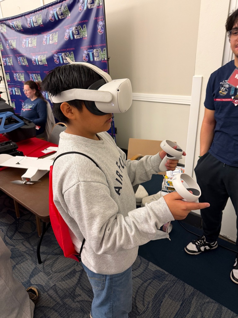 8th grade students participating in hands-on stations at the World of Work Field Trip 