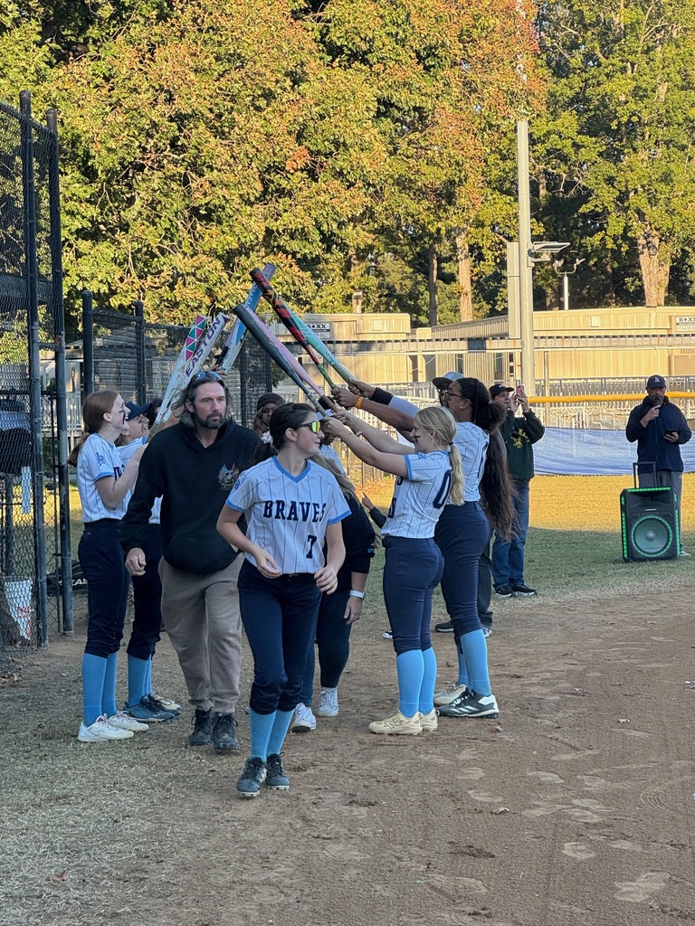 8th grade softball players being celebrated for 8th grade night