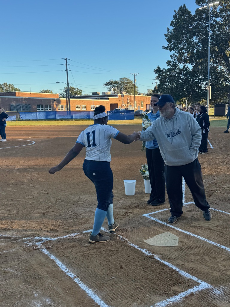 8th grade softball players being celebrated for 8th grade night