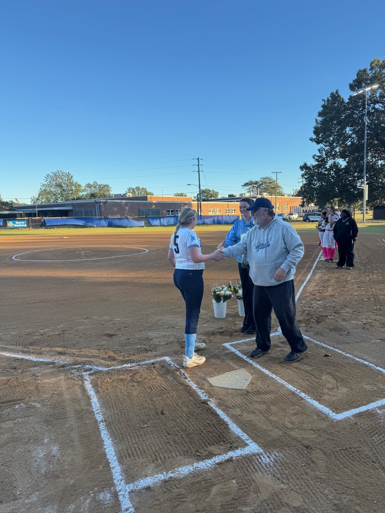 8th grade softball players being celebrated for 8th grade night