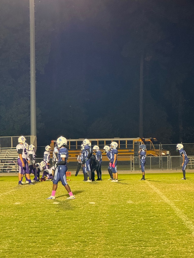 middle school football players on the field
