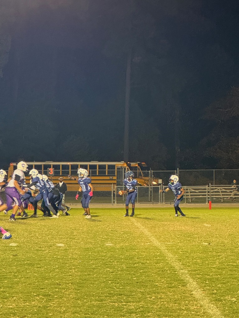 middle school football players on the field