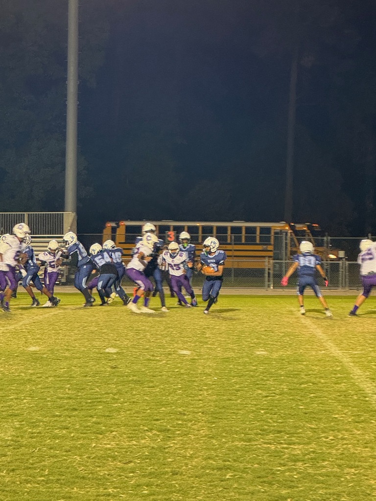 middle school football players on the field