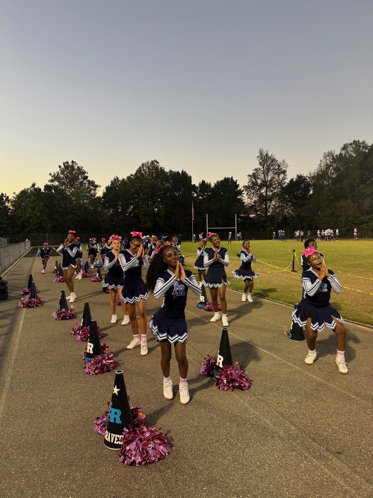 cheerleaders cheering at a football game