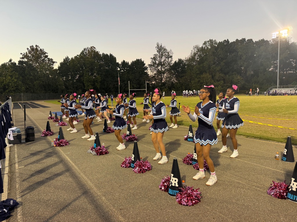 cheerleaders cheering at a football game