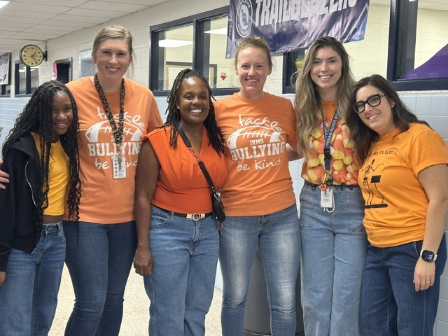 teachers and students standing together on unity day