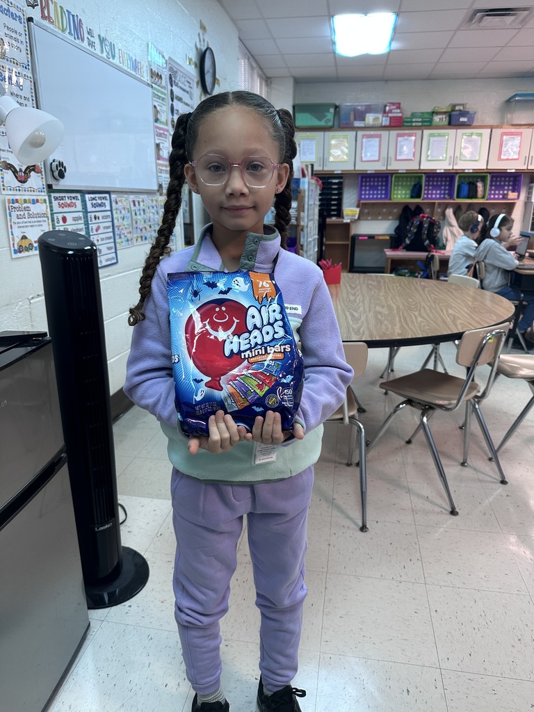 student with candy to donate