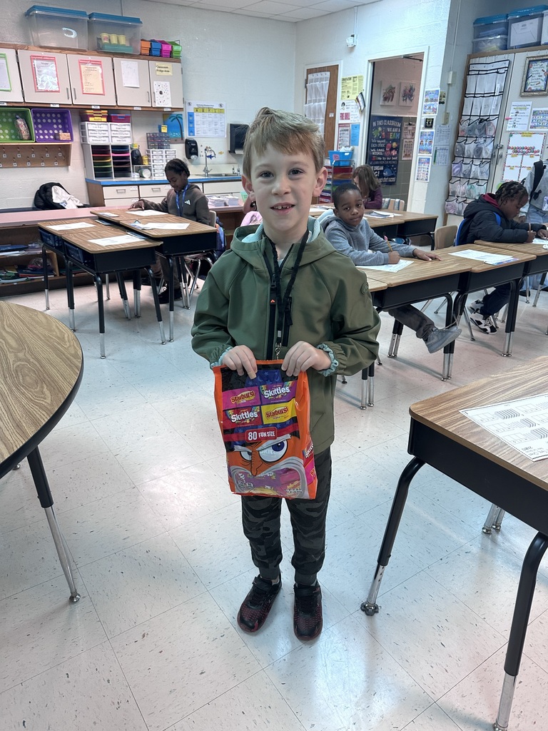 student with candy to donate