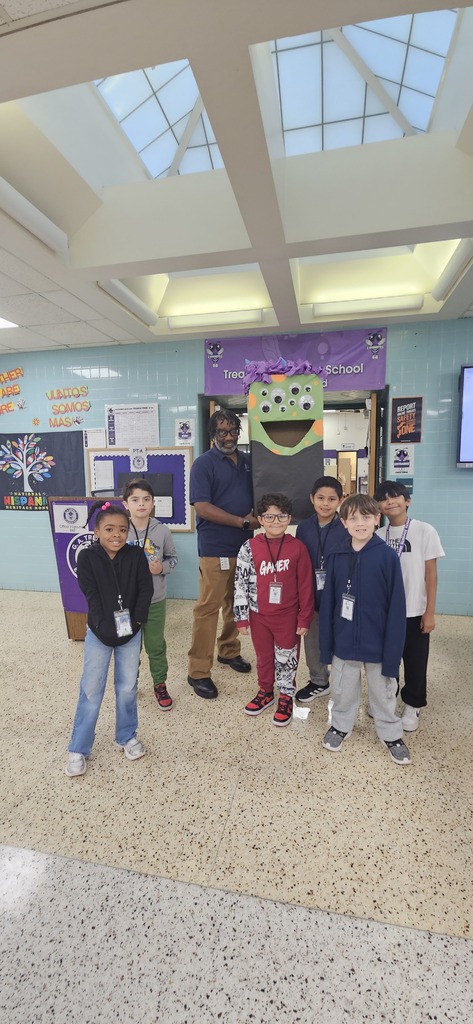 Students posing with Victor the candy  monster.
