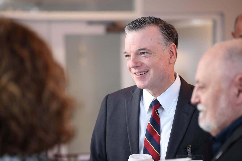 Dr. Brubaker talking with community leaders at his Engagement Council.